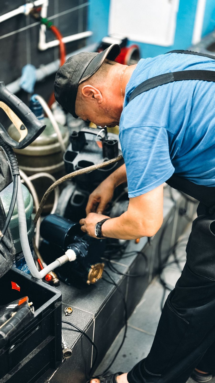 Service technician checking a machine assembly.