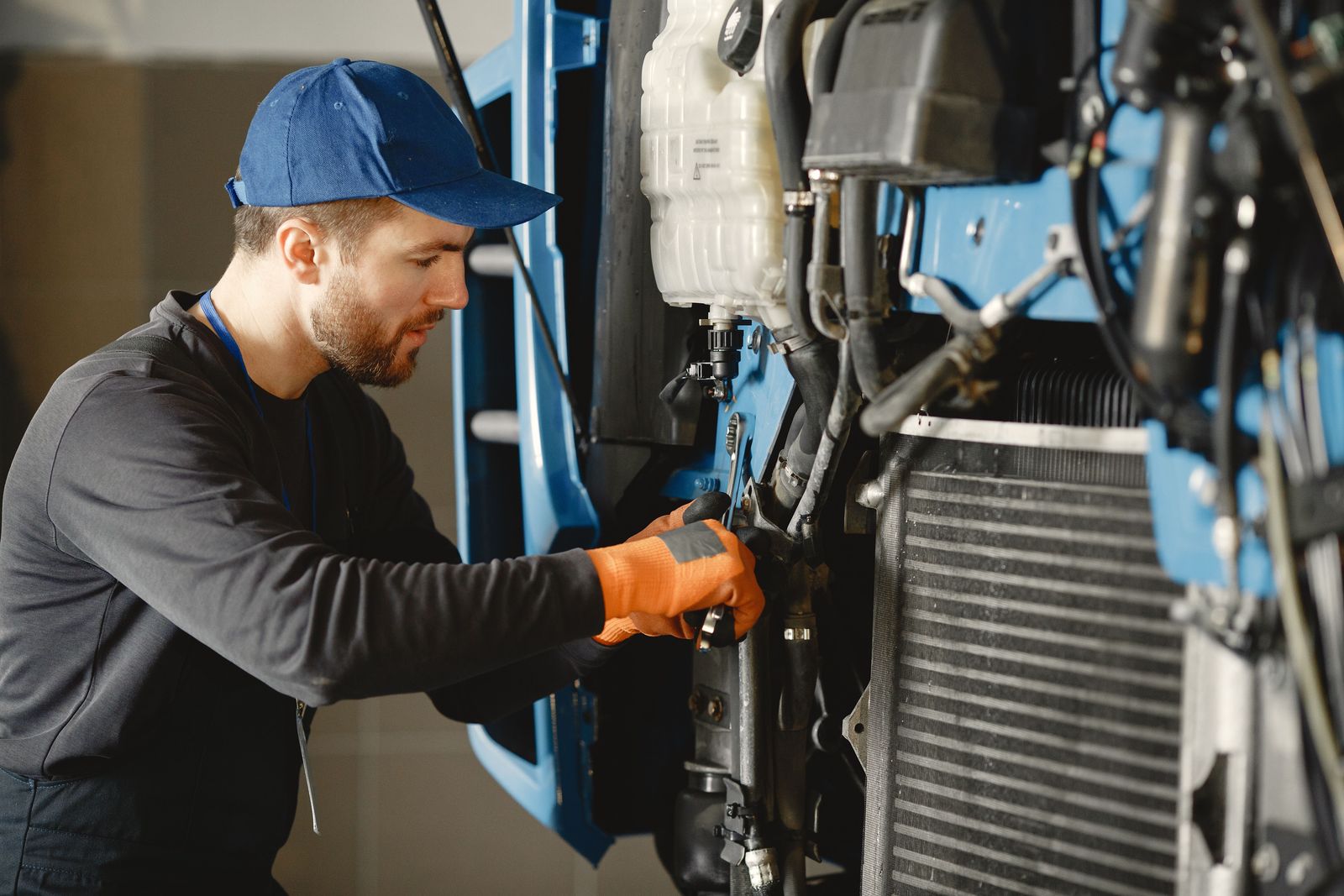 Engineer adjusting a machine on the shop floor.