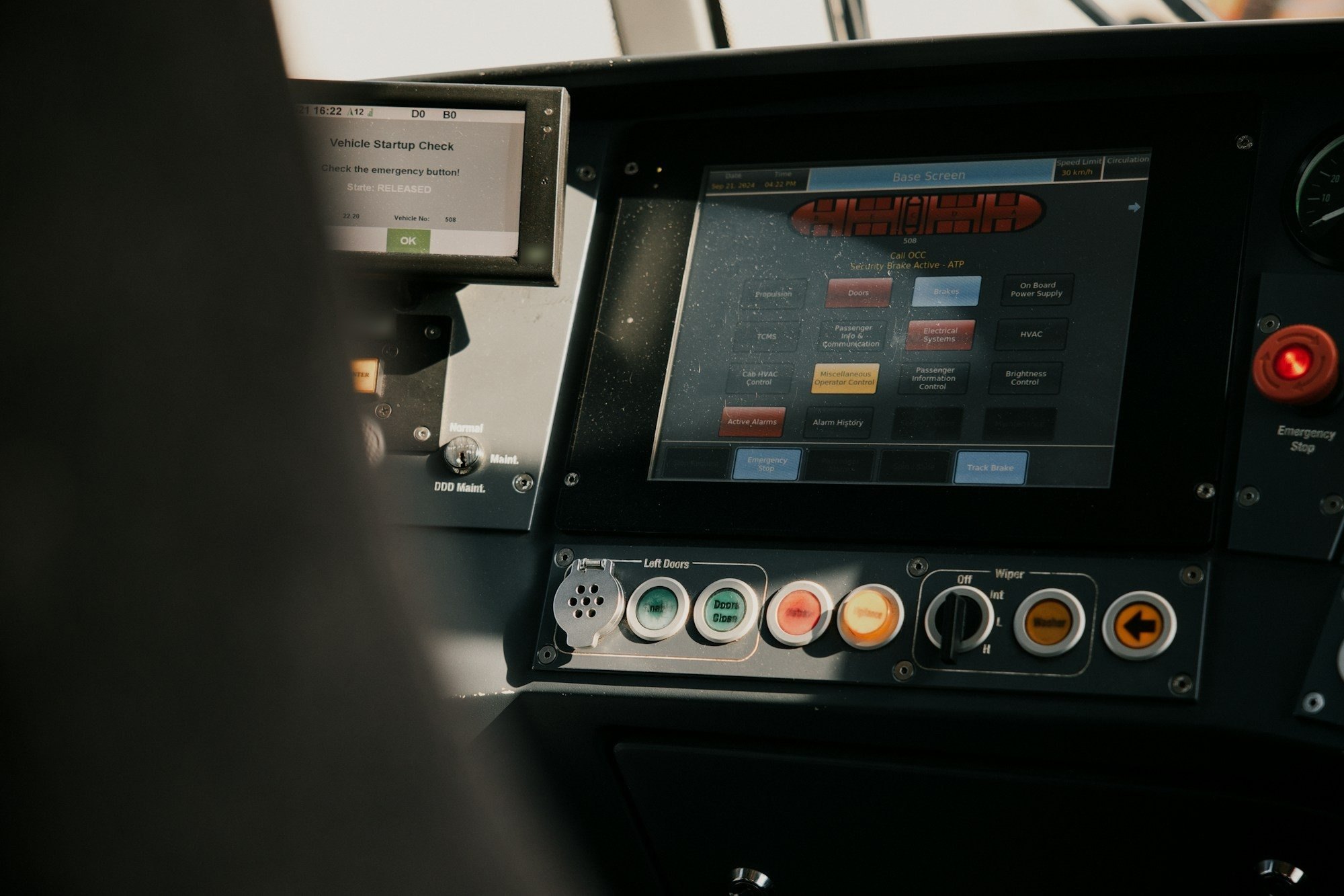Operator panel with a live system status screen and control buttons.